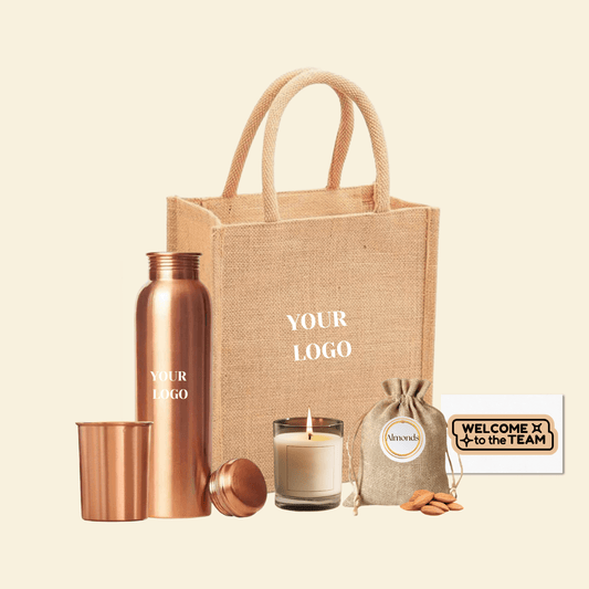 Eco-friendly wellness hamper with copper bottle, candle, almonds, and jute bag