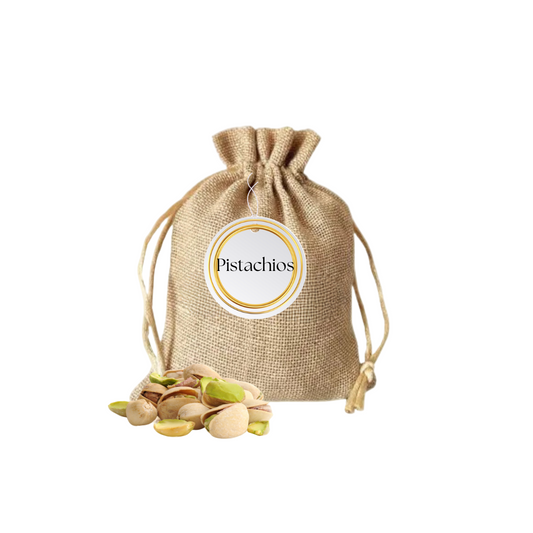 Jute bag with pistachios and a 'Pistachios' label on a beige background