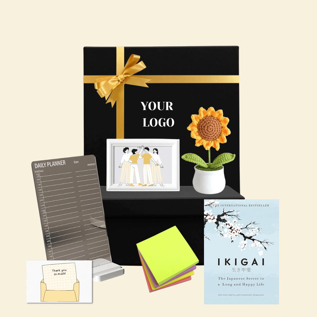 Corporate gift hamper with book, planner, flower pot, sticky notes, and personalized branding