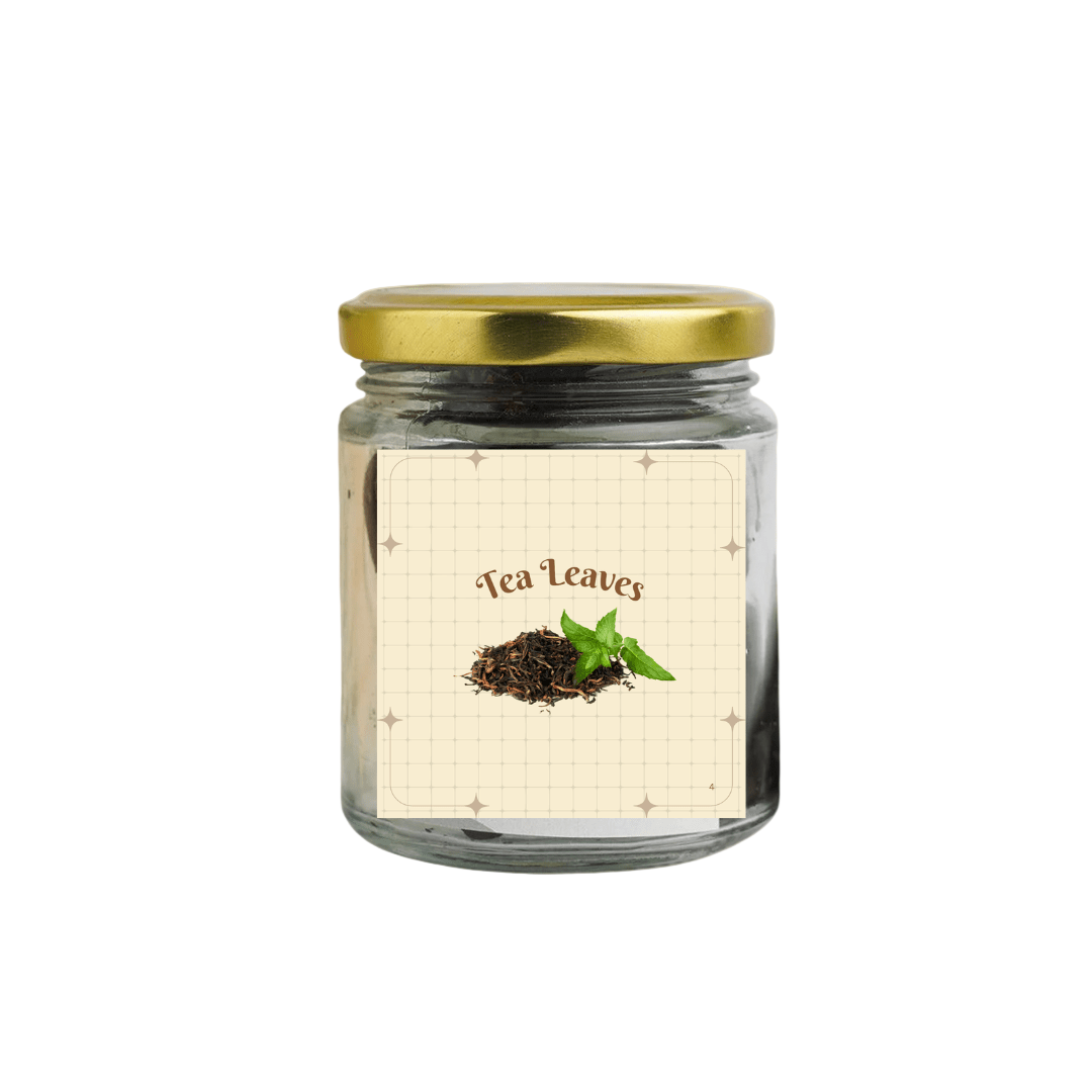 Jar of tea leaves with a gold lid on a beige background